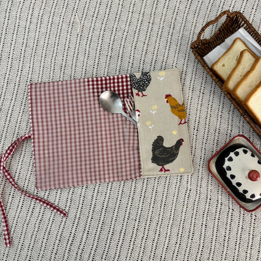 Set of placemats with chicken design on a textured surface
