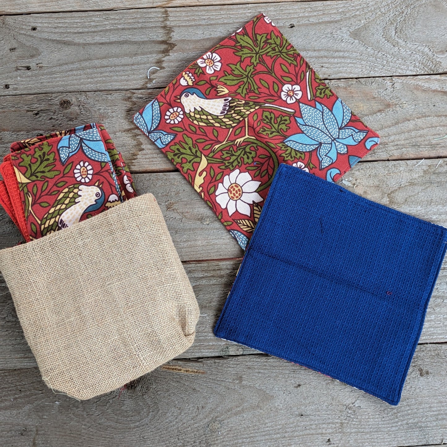 A set of unpaper towels hanging on an Indian Kitchen wall, made in pure cotton and easy to wipe clean. The texture of waffle cotton helps in scrubbing off tough stains