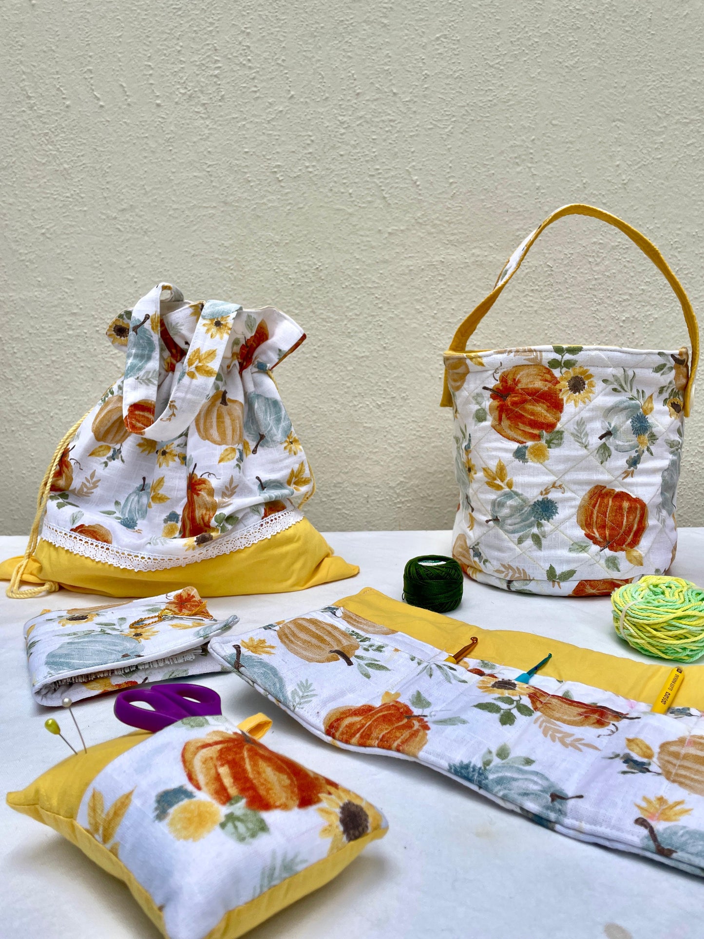 Fabric crafters caddies with pumpkin pattern on a table against a beige wall