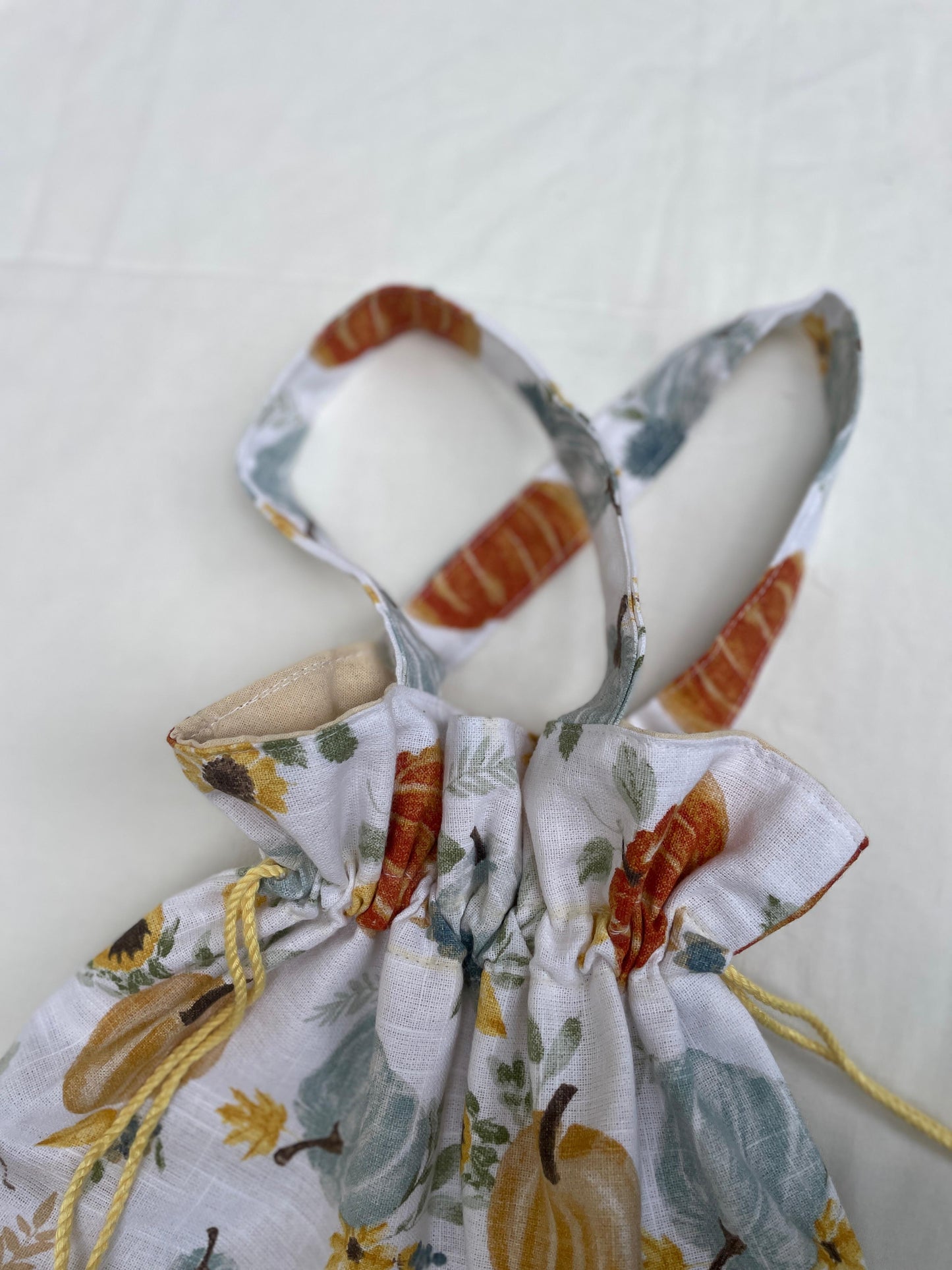 Fabric bow with autumnal design on a white background