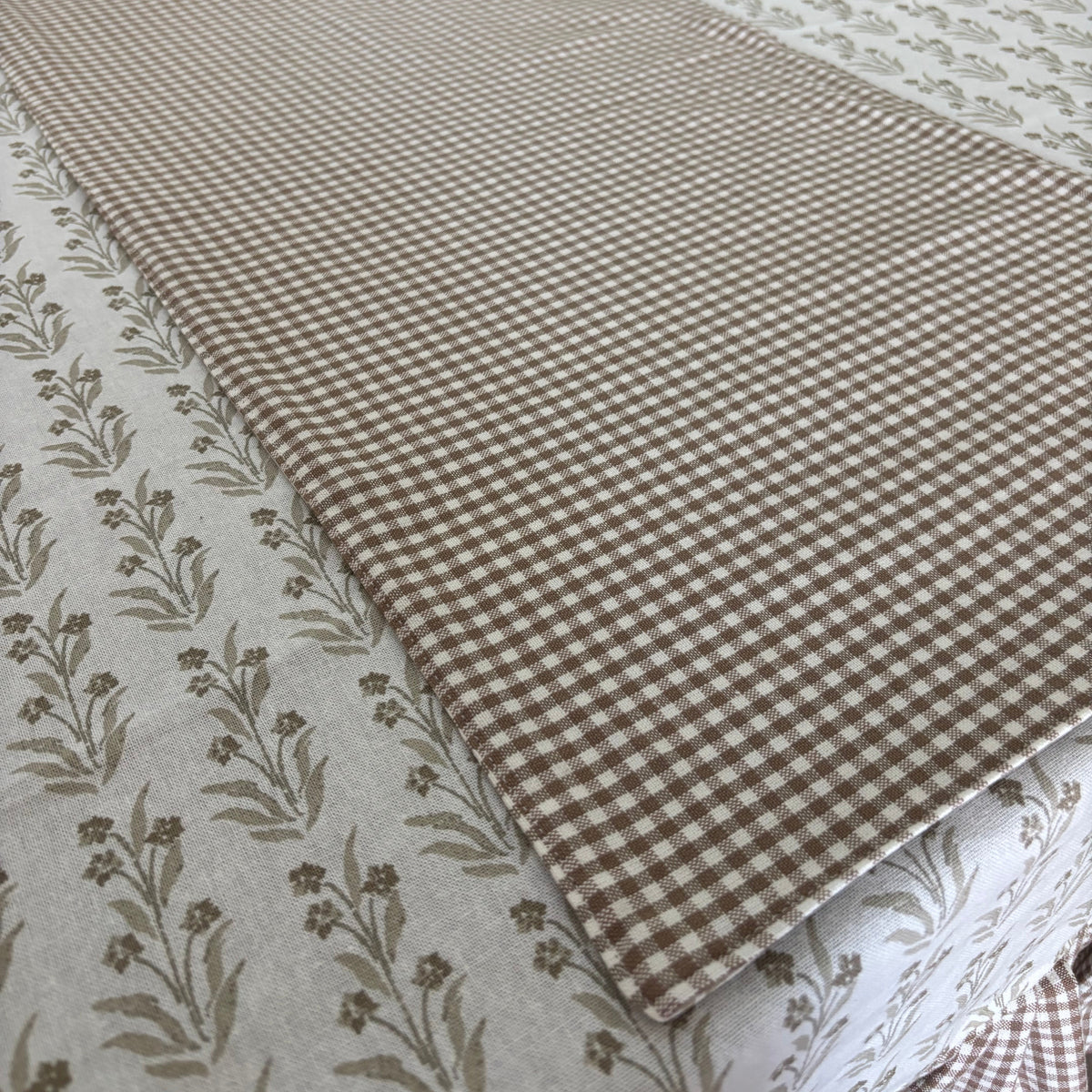 Collection of patterned fabric swatches on a table
