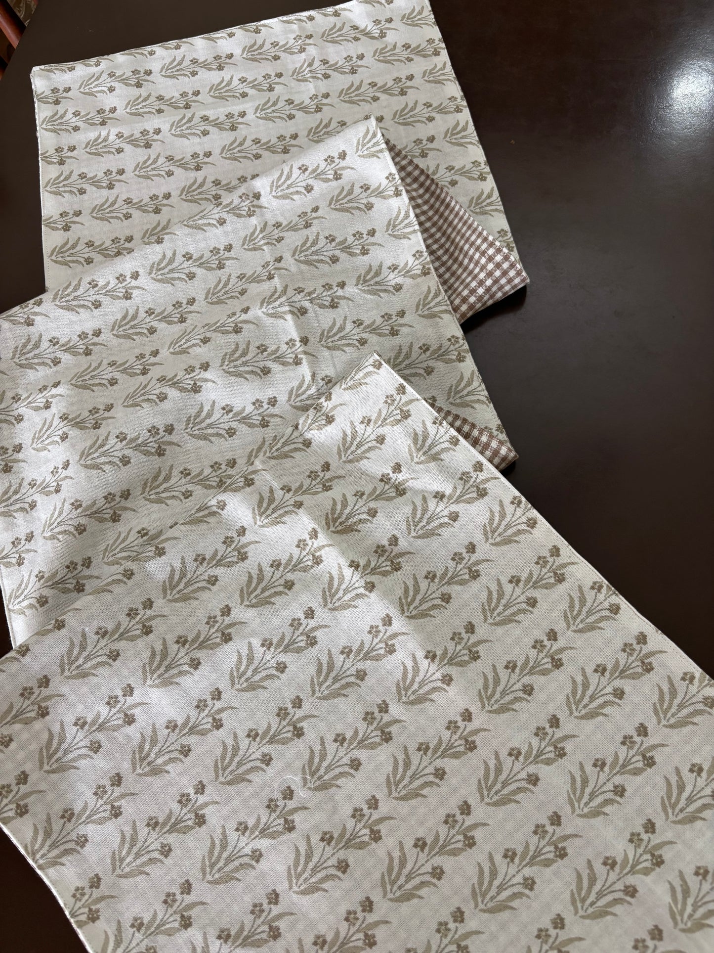 Three sheets of patterned paper on a dark surface