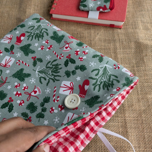 Handmade fabric cover with Christmas pattern on a notebook