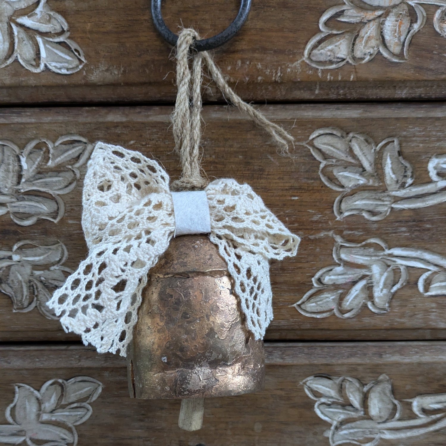 Rustic metal cowbell with Christmas bow